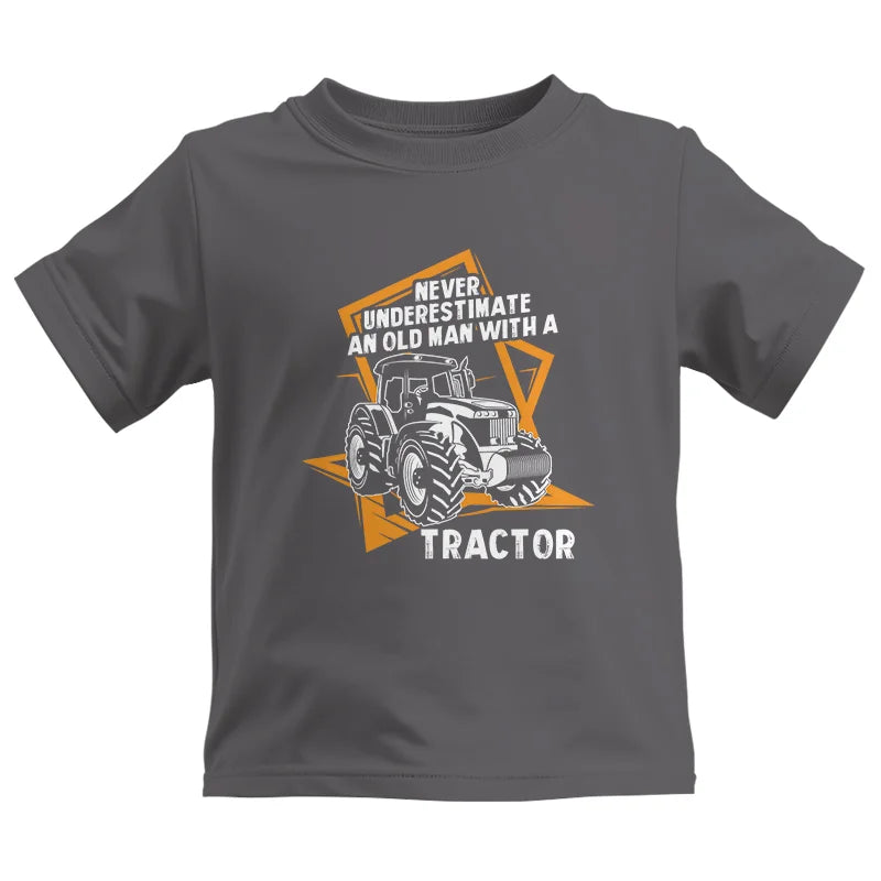 Image of Never Underestimate An Old Man With A Tractor Farming Dad - Kids Heavy Cotton™ Tee