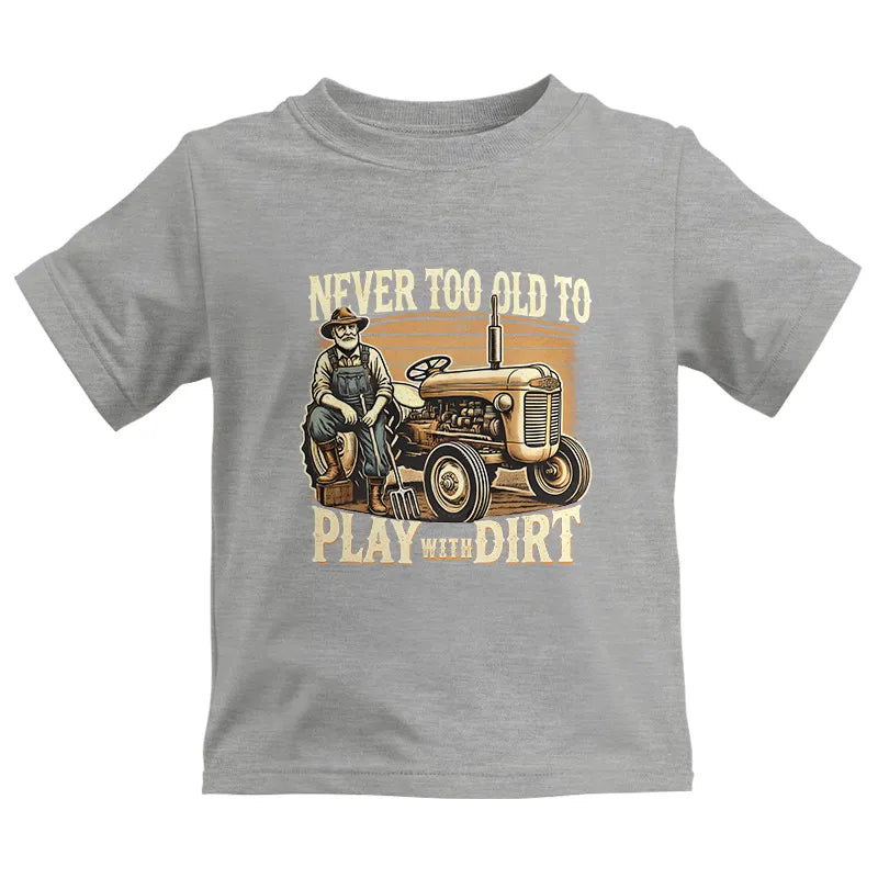 Image of Never Too Old To Play With Dirt - Kids Heavy Cotton™ Tee