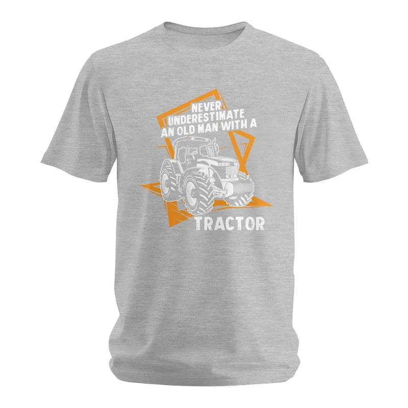 Image of Never Underestimate An Old Man With A Tractor Farming Dad - Unisex Softstyle T-Shirt